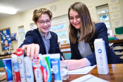 Two Amherst pupils in science comparing toothpaste
